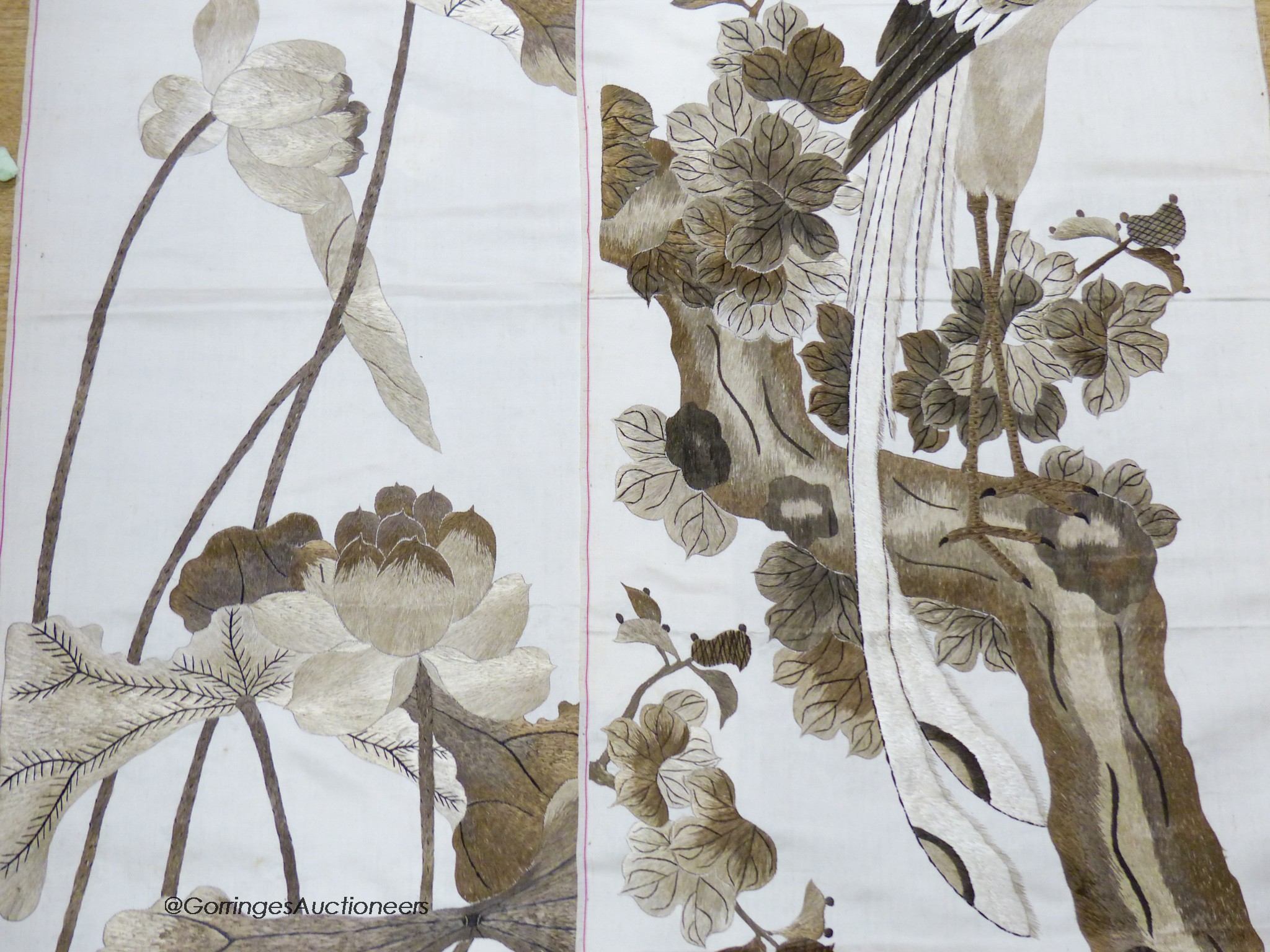 A pair of Chinese embroidered silk panels of birds amid flowers, circa 1900, 130 x 36cm